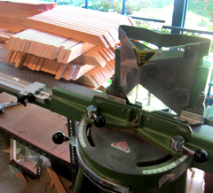The miter cutter has two blades that cut the wood length at 45 degree angles